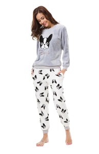 Image of a girl wearing boston terrier print pajamas in the cutest warm fleece fabric