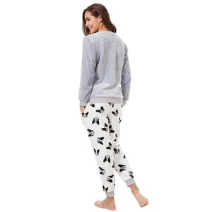 Back image of a girl wearing boston terrier pajamas for women in the cutest warm fleece fabric