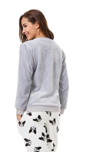 Back image of a girl wearing pajamas boston terrier in the cutest warm fleece fabric
