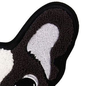 Close up image of an ear of boston terrier patch