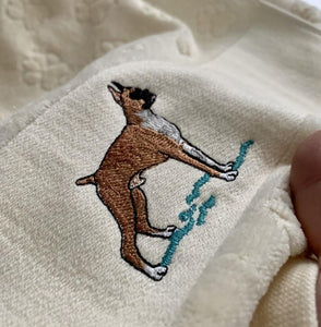 Close up image of a boxer dog towel