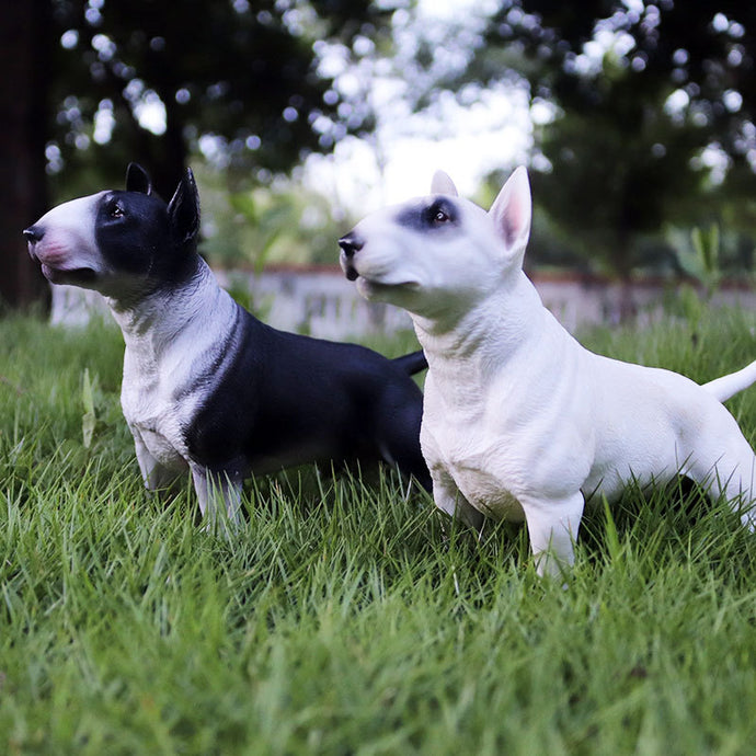 Image of two bull terrier figurines in the color white and black & white