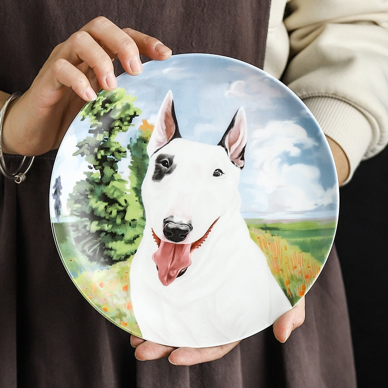 Image of a lady holidng bull terrier plate made of bone china in a beautiful Bull Terrier print