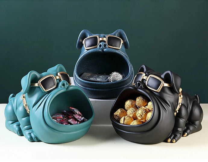 Image of three super cute bulldog piggy banks in the color black, textured blue, and green blue