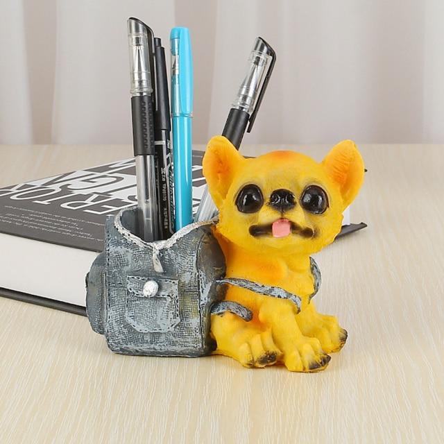 Image of a pen or pencil holder Chihuahua figurine made of resin, featuring the cutest Chihuahua with a denim backpack design