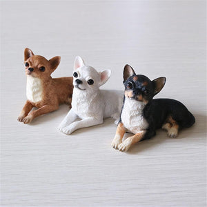 Image of three sitting Chihuahua figurines in three beautiful Chihuahua colors including Fawn, White, and Black Tri!
