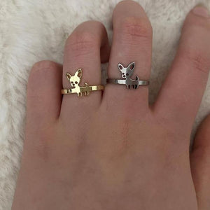 Image of a person wearing two super-cute Chihuahua rings in Chihuahua designs in the color gold and silver, made of stainless steel