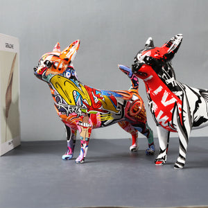 Side image of two multicolor graffiti design Chihuahua statues