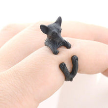 Load image into Gallery viewer, Image of a finger wrap Chihuahua ring on the finger of a person in the color Black Gun