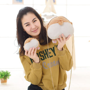 Image of a lady holding two butt Corgi handbags in small and medium size in the most adorable plush Corgi bum design