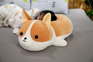 Image of a girl sleeping on a Corgi stuffed animals soft plush toy