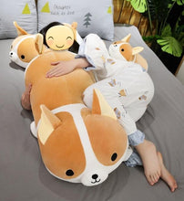 Load image into Gallery viewer, Image of a girl sleeping on the bed with three Corgi stuffed animals soft plush toys in different sizes