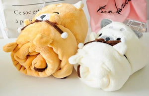 This image shows an adorable Corgi Love Portable Plush Travel Blanket kept folded on a table.