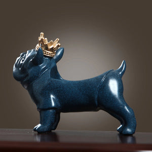 Back profile of a French bulldog statue in blue with a gold crown