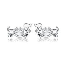 Load image into Gallery viewer, Image of two silver sausage dog earrings