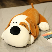 Load image into Gallery viewer, This image shows an adorable brown colored Basset Hound Stuffed Animal Plush Pillow lying on a bed.