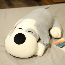 Load image into Gallery viewer, This image shows an adorable grey colored Basset Hound Stuffed Animal Plush Pillow lying on a bed.
