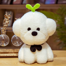 Load image into Gallery viewer, This image shows a cute Bichon Frise Stuffed Animal Plush Toy with a grass on it&#39;s head and sitting on the table.