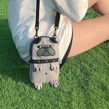 Load image into Gallery viewer, Image of a super-cute English Bulldog bag with a cutest Bulldog print in the color Khaki carried by a girl sitting on grass