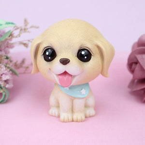 Image of a Golden Retriever bobblehead in the shape of a Golden baby with big beady eyes