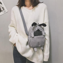 Load image into Gallery viewer, Image of a lady holding pug messenger bag in the color Gray