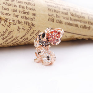 Back image of a rose gold coloured boston terrier pendant with a red stone studded heart