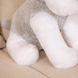 this image shows the close up image of the body of Cutest Schnauzer Stuffed Animal Plush Toy sitting on the sofa .