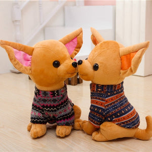 Image of two sitting Chihuahua stuffed animals that look like they're kissing