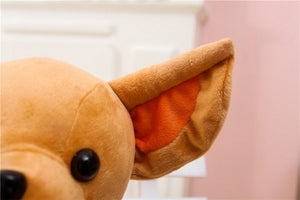 this image shows a close up , zoomed image of the eyes of the cutest chihuahua stuffed animal plush toy.