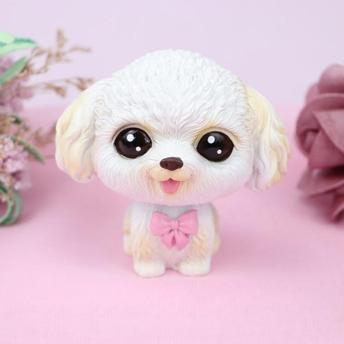 Image of a white Shih Tzu bobblehead in the shape of a Shih Tzu baby with big beady eyes