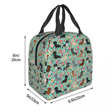 Load image into Gallery viewer, Image of the size of an insulated green color Dachshund lunch bag with exterior pocket in bloom design