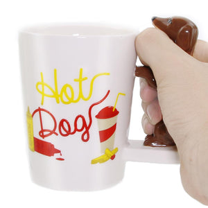 Image of dachshund cup holding by a person