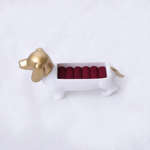 Image of a beautiful white and gold colored Dachshund jewelry box in the shape of Dachshund made of resin