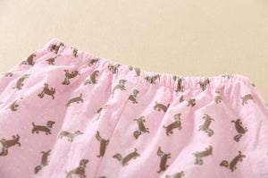 Image of a pink color Dachshund Pajama set bottom close view with an infinite dachshund print design