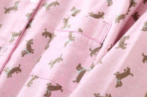 Image of a pink color Dachshund Pajama set stuff close view with an infinite dachshund print design