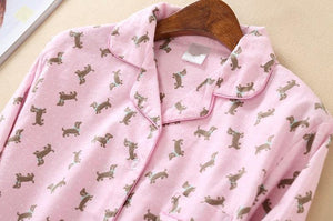 Image of a pink color Dachshund Pajama set shirt's close front view with an infinite dachshund print design