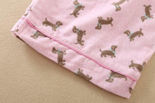 Load image into Gallery viewer, Image of a pink color Dachshund Pajama set sleeves close view with an infinite dachshund print design