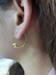 image of lady wearing dachshund earrings
