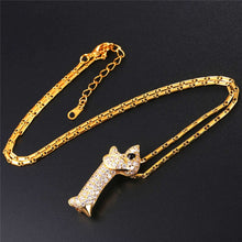 Load image into Gallery viewer, Image of a stone studded doxie necklace in the color gold