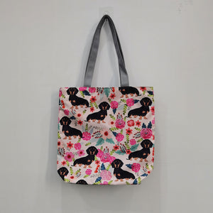 Image of a Sausage dog tote bag in a most adorable sausage dog in bloom design