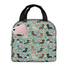 Load image into Gallery viewer, Image of an insulated green color Dachshund lunch bag with exterior pocket in bloom design