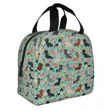 Load image into Gallery viewer, Image of an insulated green color Dachshund bag with exterior pocket in bloom design