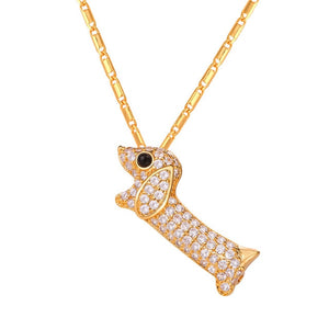 Image of a gold color stone studded dachshund necklace