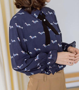 Image of a girl wearing Dachshund shirt in the color navy blue with infinite Dachshunds design