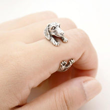 Load image into Gallery viewer, Image of a finger wrap Dachshund ring on the finger of a person in the color Antique Silver