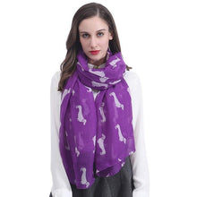 Load image into Gallery viewer, Image of a girl wearing a beautful Dachshund scarf in the color purple with infinite Dachshunds design