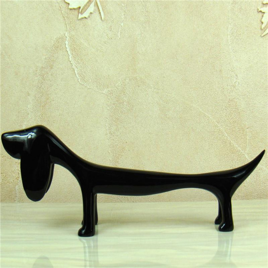 Image of a Dachshund statue in the color black made of resin
