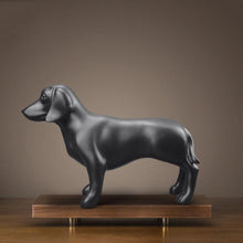 Load image into Gallery viewer, Image of a stunning black Dachshund statue made of resin