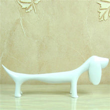 Load image into Gallery viewer, Image of a Dachshund statue in the color white made of resin