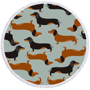 Image of a round dachshund towel with black and red and tan dachshunds on green-blue background